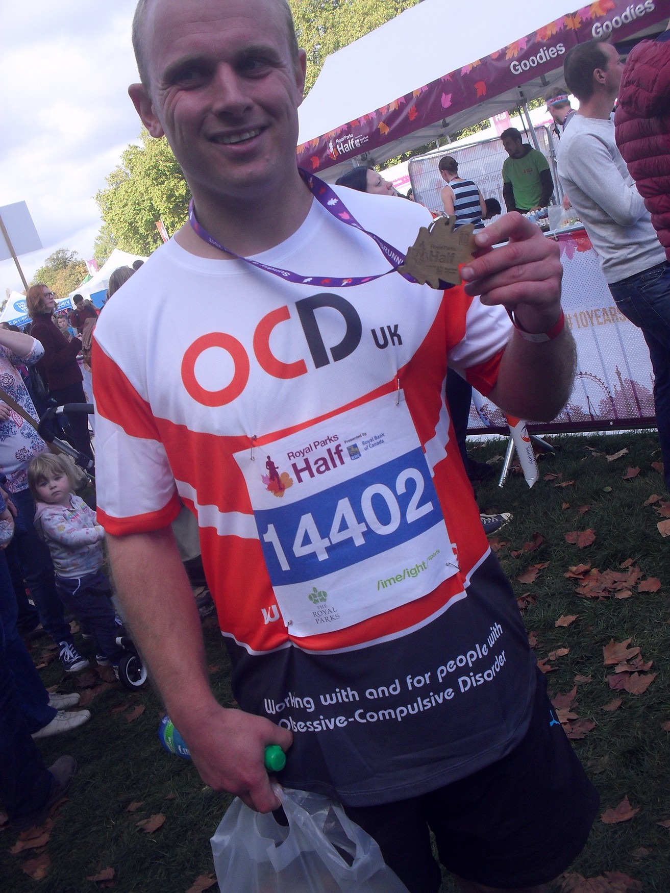 Adam wearing his OCD-UK t-shirt running over some grass during the 2017 Great North Run.