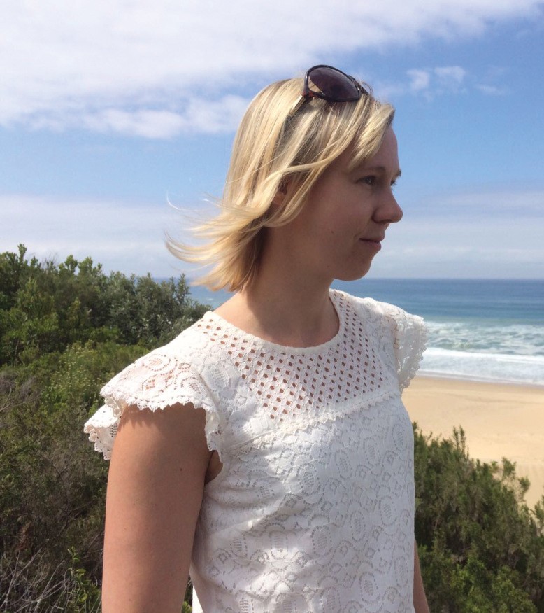 Dr Lucy Oldfield - pictured looking at over a beach towards the coastline
